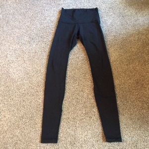 Black Lululemon high waisted leggings.  Size 4.